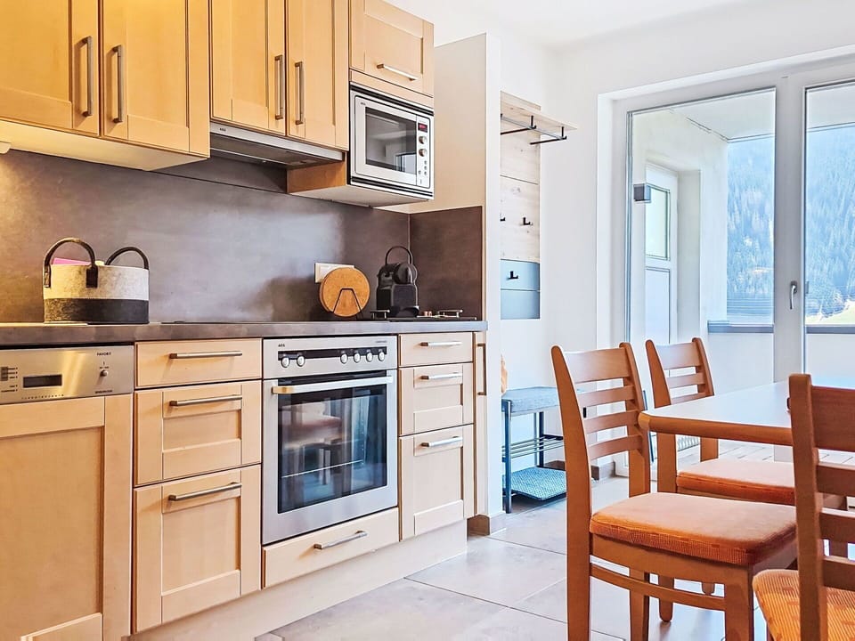 Furniture, Kitchen, Interior Design, Kitchen Appliance, Countertop, Cabinetry, Flooring, Major Appliance, Wood, Room