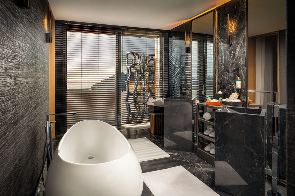 Paris Suite | Bathroom | Shower, designer toiletries, hair dryer, bathrobes
