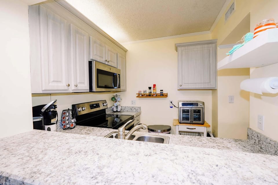 Fully equipped kitchen with stainless steel appliances