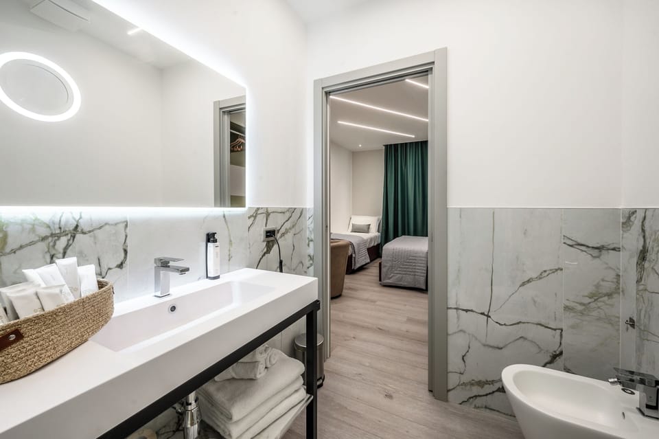 Family Triple Room, Balcony, Courtyard View | Bathroom | Shower, rainfall showerhead, free toiletries, hair dryer