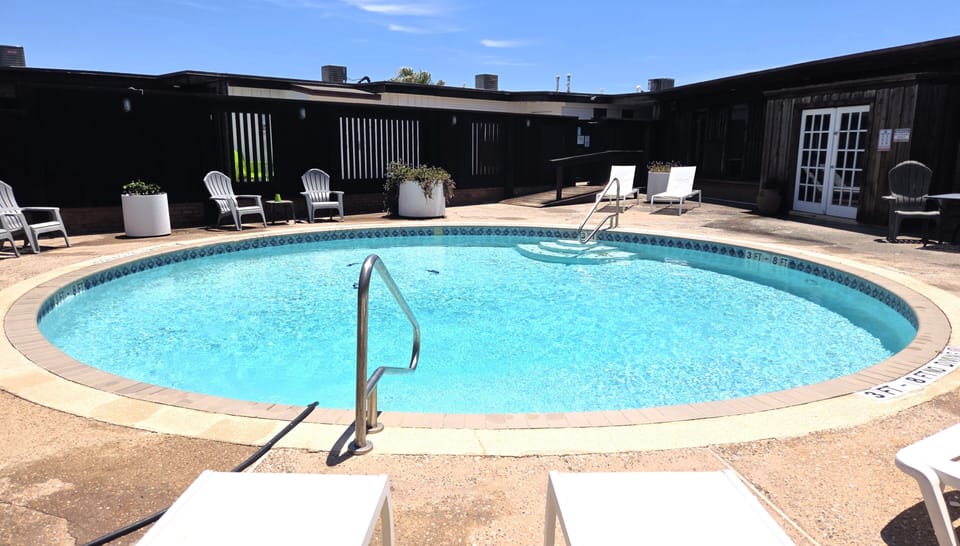 Cool off in the community pool after a fun beach day.