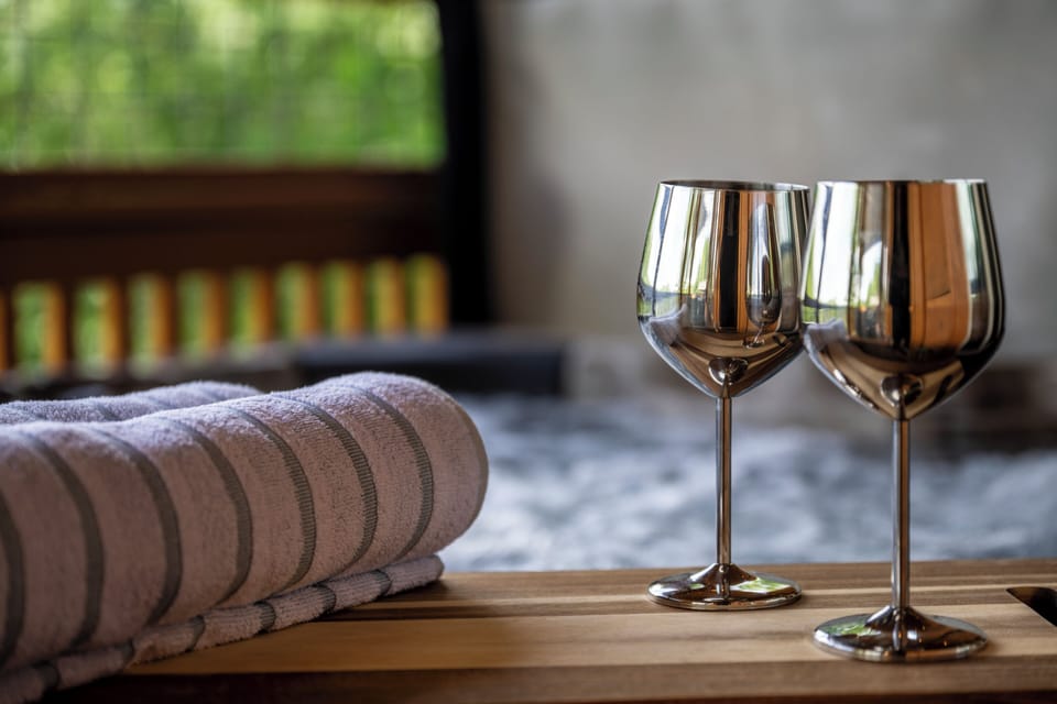 Soak in the private hot tub while taking in peaceful mountain views.