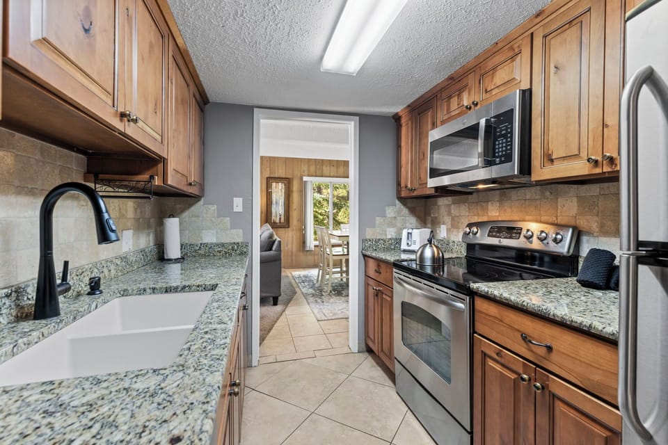 Condo, Multiple Beds, Patio, Garden View (Columbine #301) | Private kitchen | Dining table