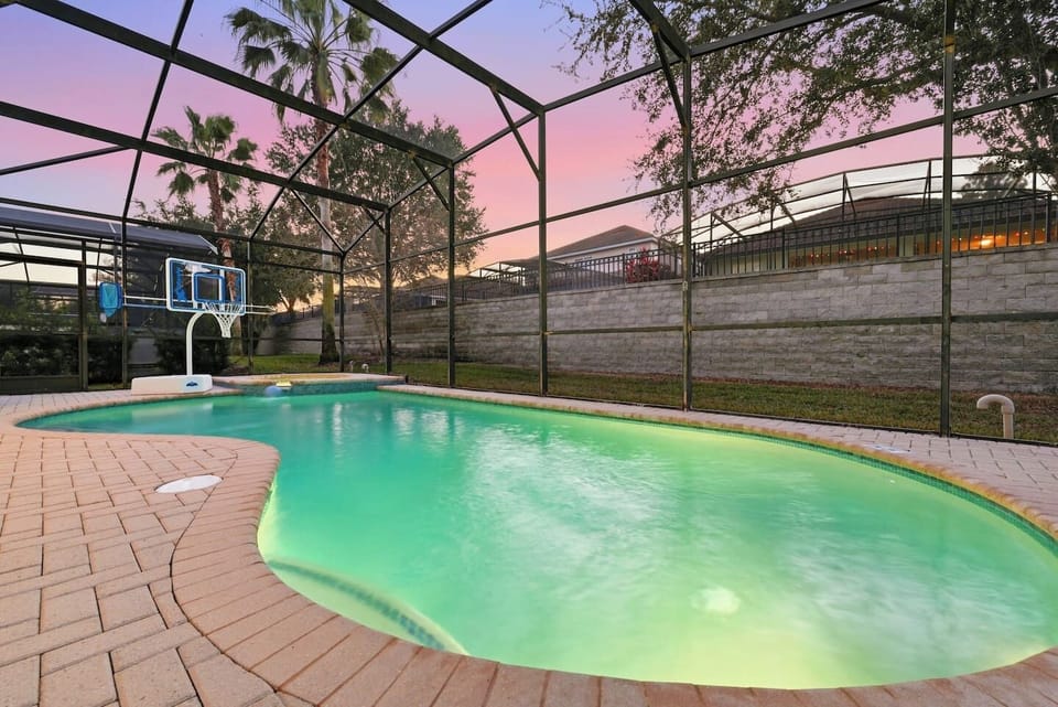 Pool Oasis: Dive into relaxation in your private pool with a sunset view and fun basketball!
