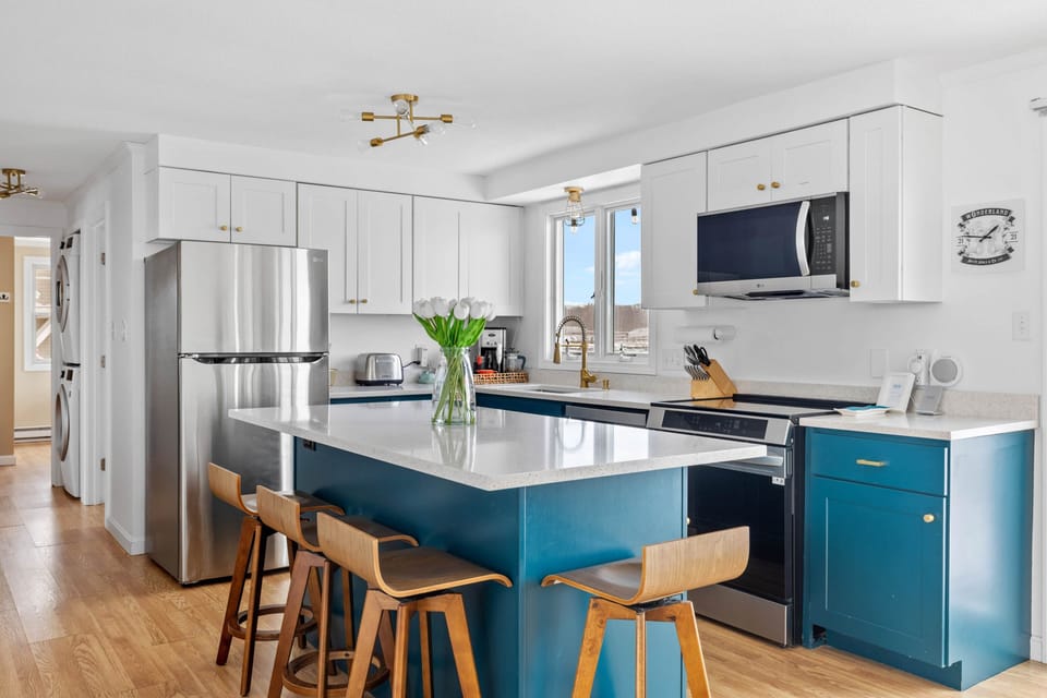 The kitchen has a spacious island with seating for four.