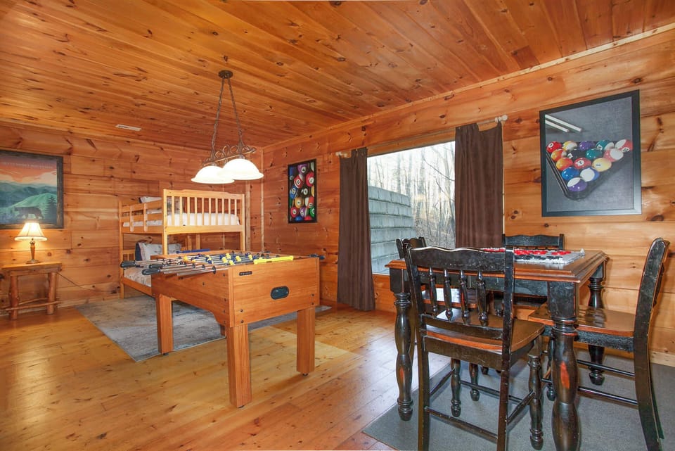 Game room with foosball, Pac-Man arcade, checkers, and smart TV