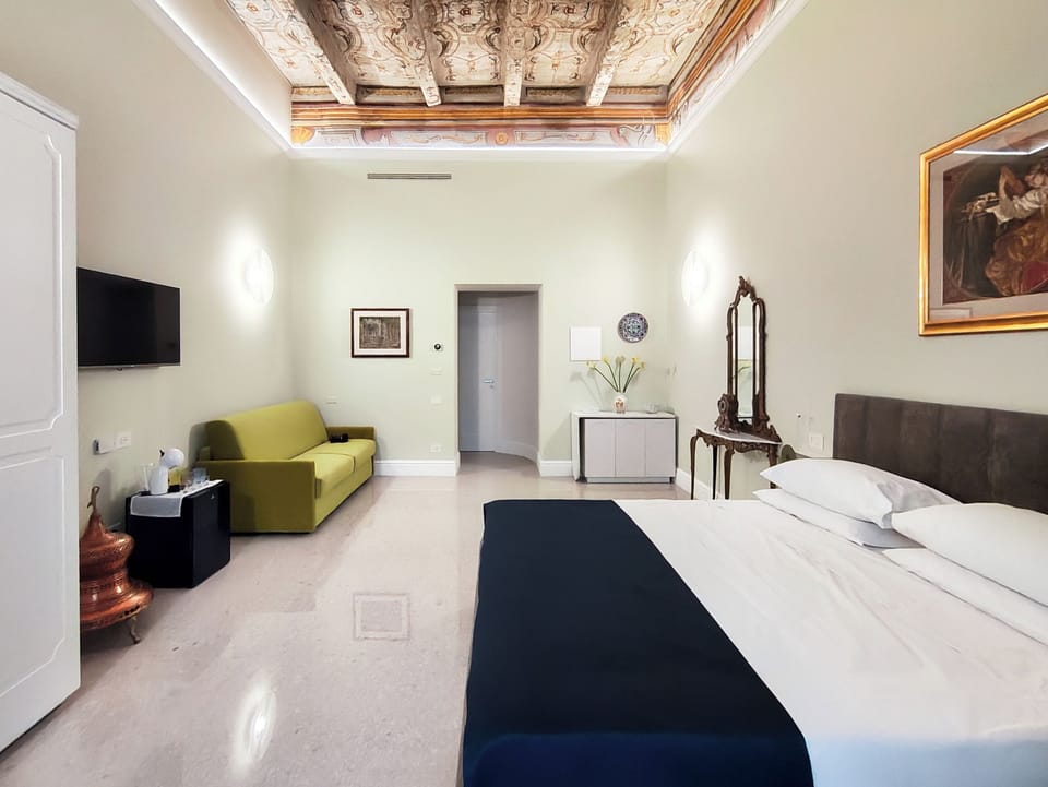 Luxury Suite, Balcony, City View | Individually furnished, desk, free WiFi, bed sheets