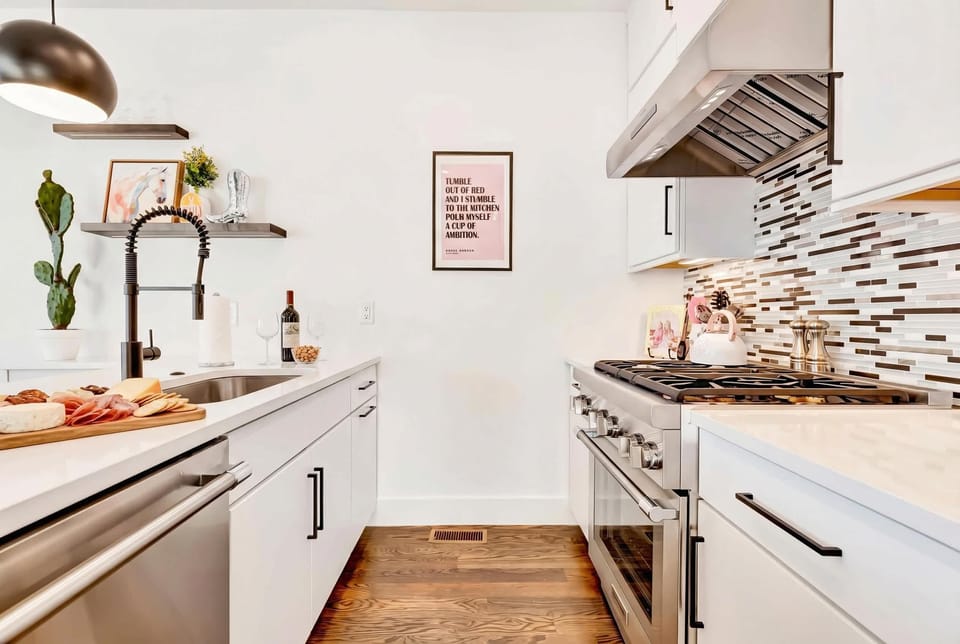 Full kitchen with a stove and oven so you can grill dinner outside and prep sides inside without coordination chaos