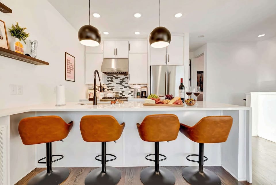 Experience Music City luxury in this chic kitchen, perfect for gatherings with friends. Enjoy gourmet cheese and wine while planning your Nashville adventures. This upscale rental is ideal for a bachelorette party or family reunion, offering stylish comforts for an unforgettable getaway!