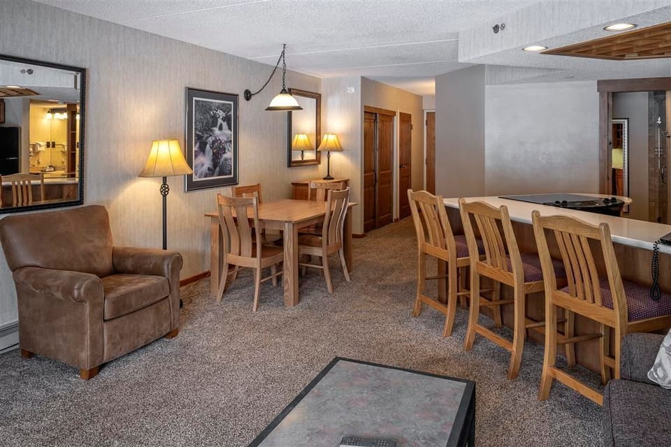 Relax in the inviting living room with cozy seating and rustic accents.