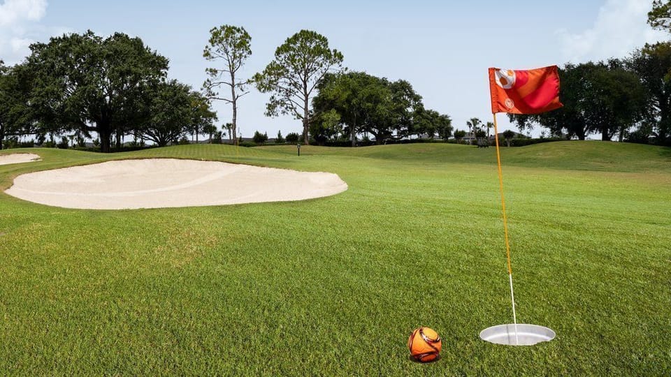 Perfect your swing on the lush golf course under the bright Florida sun.