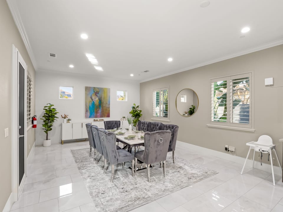 Elegant dining area with seating for the whole group, conveniently located next to the open kitchen.