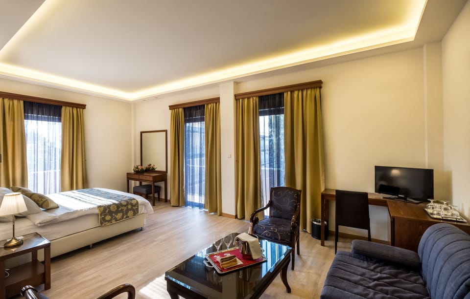 Executive Quadruple Room, City View | Minibar, in-room safe, free WiFi, bed sheets