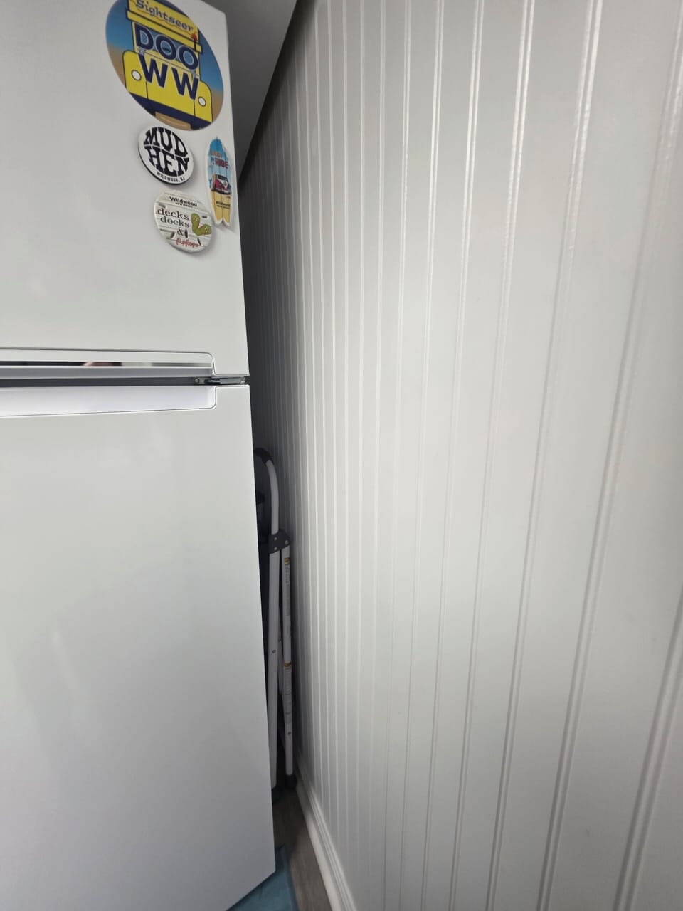step stool alongside the refrigerator 