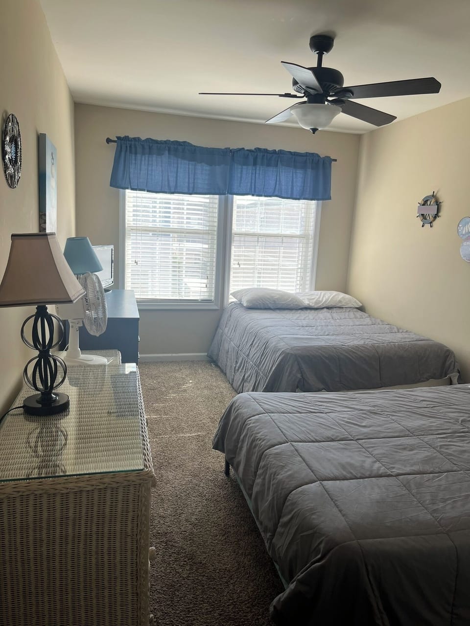 Upstairs bedroom with 2 full beds, flat TV and closet