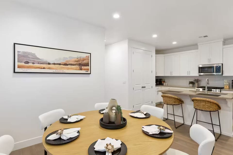 Spacious open-concept main level featuring a kitchen with a large island and dining area.