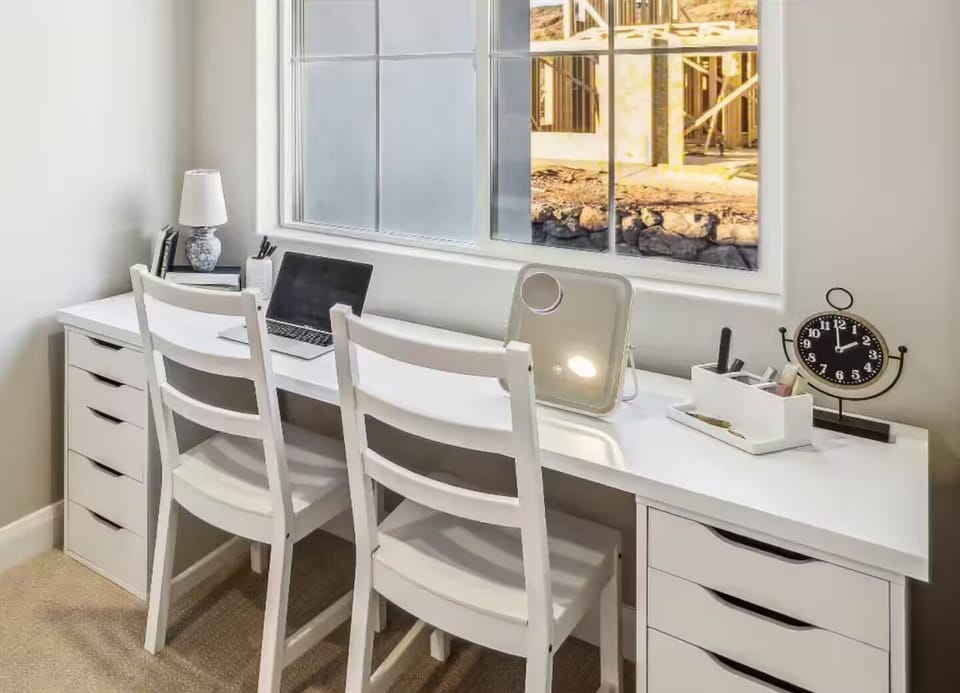 The master bedroom offers the perfect blend of comfort and productivity, allowing you to work or catch up in a quiet, private setting.
