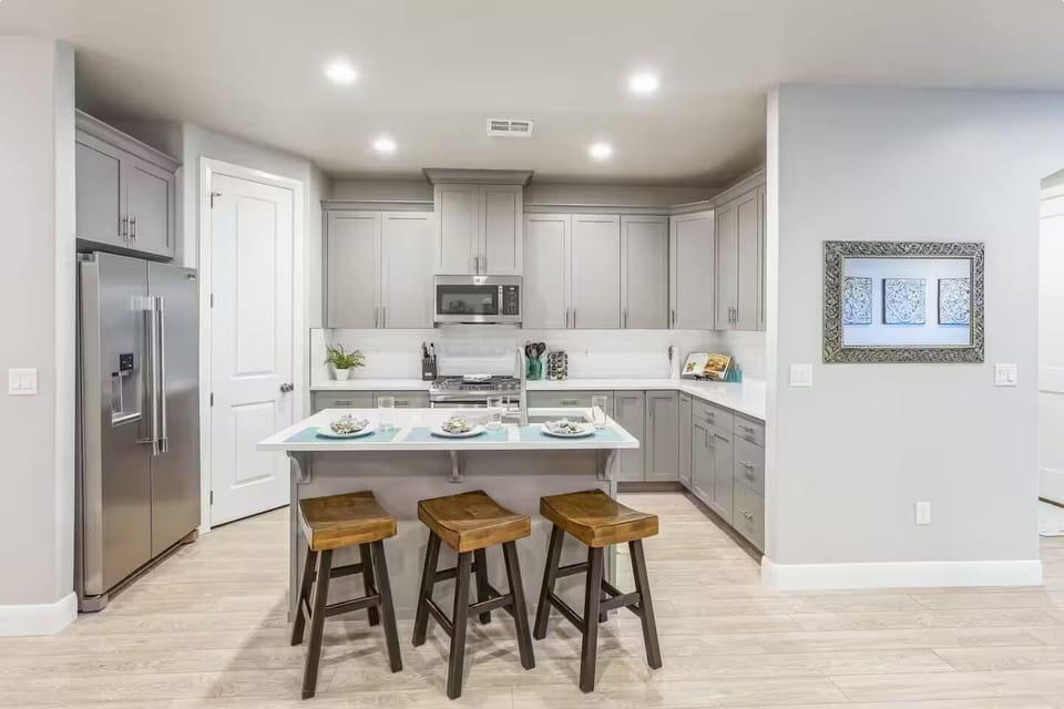 Gorgeous kitchen with breakfast bar and plenty of counter space, perfect for meal prep or casual dining.
