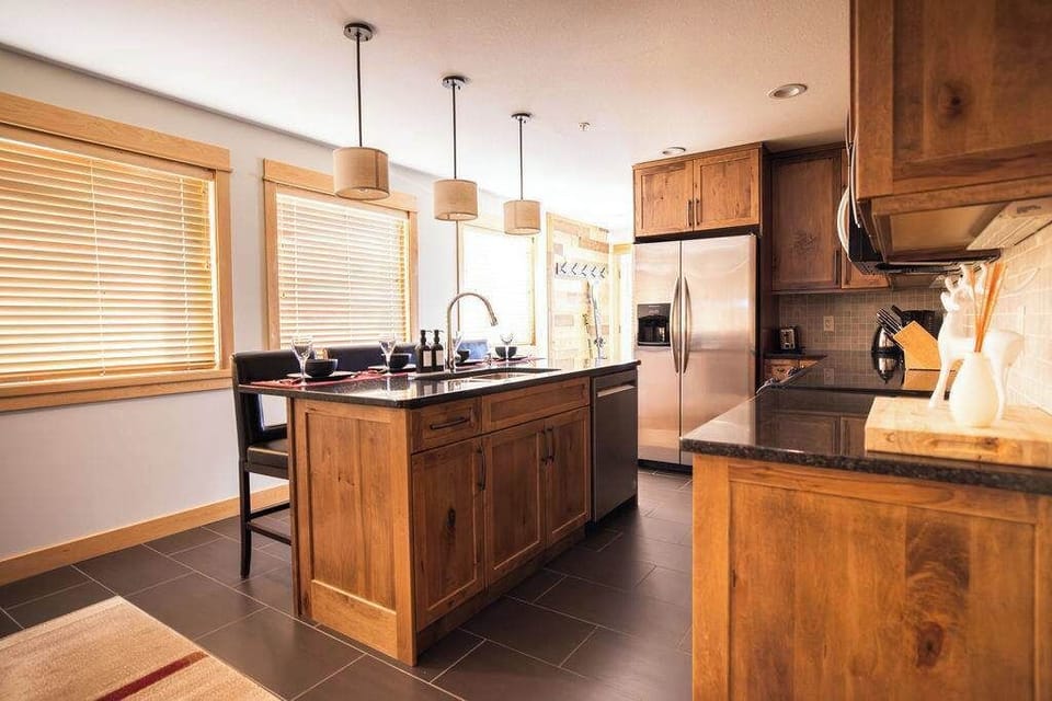 Full kitchen with island and stainless appliances