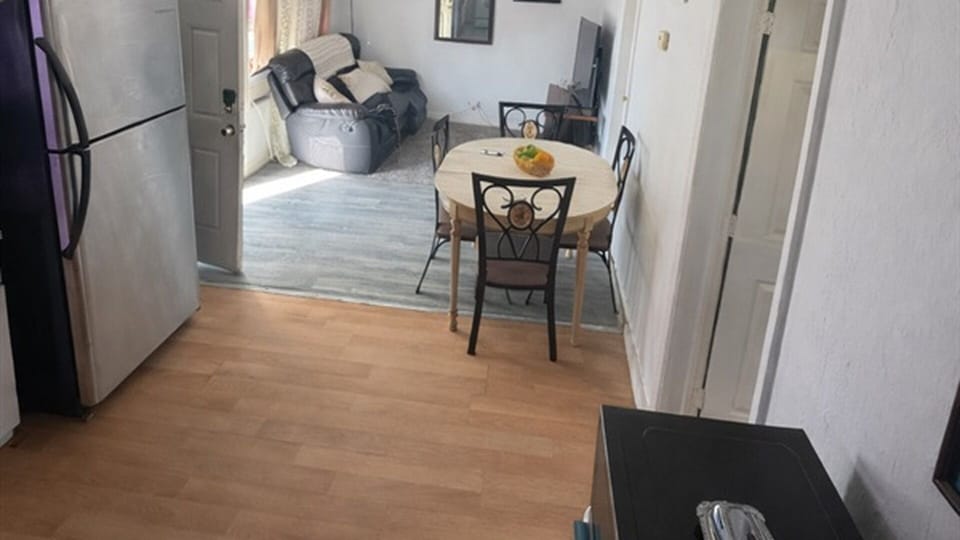 Kitchen view toward dining and living area