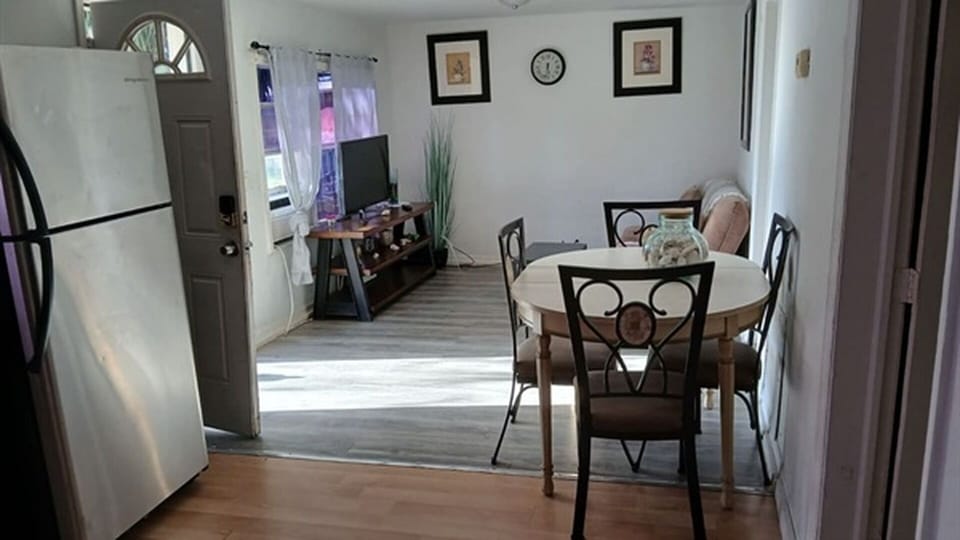 Living and dining area with TV and table