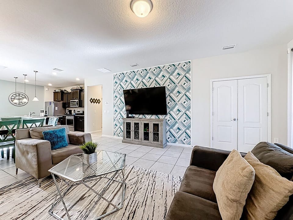 Open-concept living area with modern décor and cozy seating.