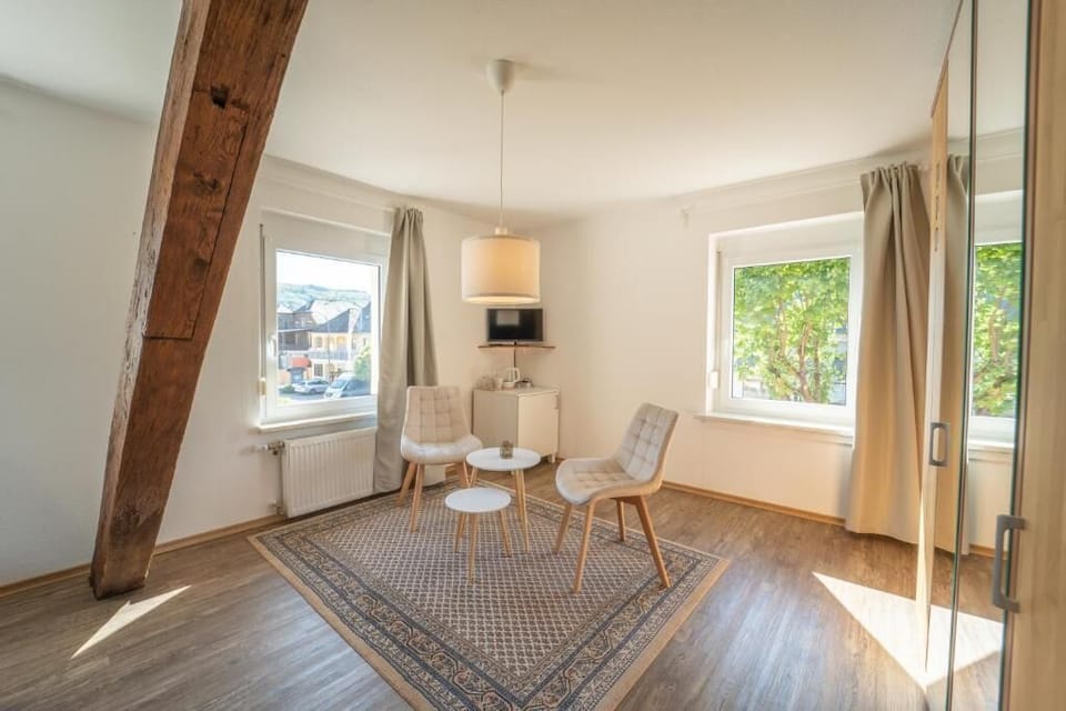 Comfort Double Room, City View | Living area | 24-inch Smart TV with cable channels