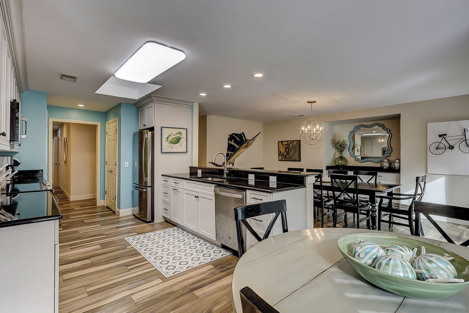 Fully stocked kitchen with all stainless steel appliances.
