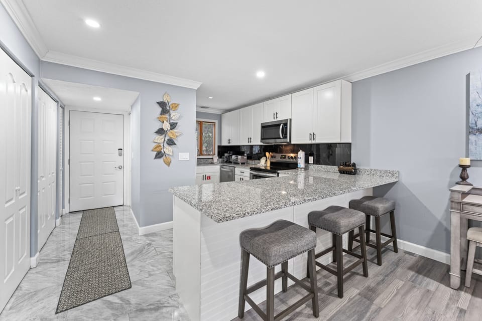 view of kitchen and bar stools