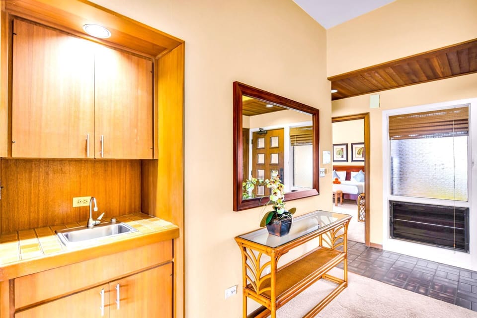 Warm wood finishes and neutral tones create a comfortable welcome just inside the entry. KRV-2121