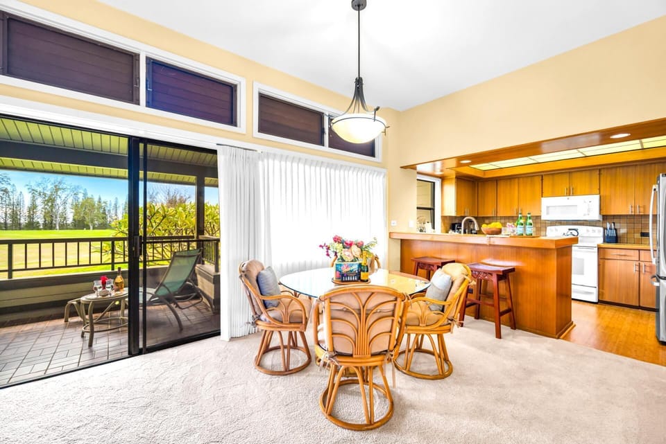 Your dining area sits just off the kitchen and lanai, with garden views and breezy natural light. KRV-2121