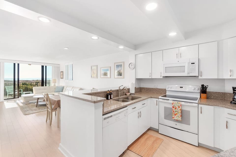 Fully stocked kitchen with an open layout, surely to let all the light in