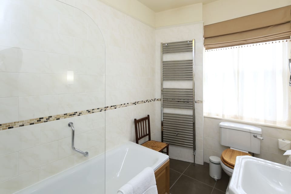 Bathroom | Shower, designer toiletries, hair dryer, towels