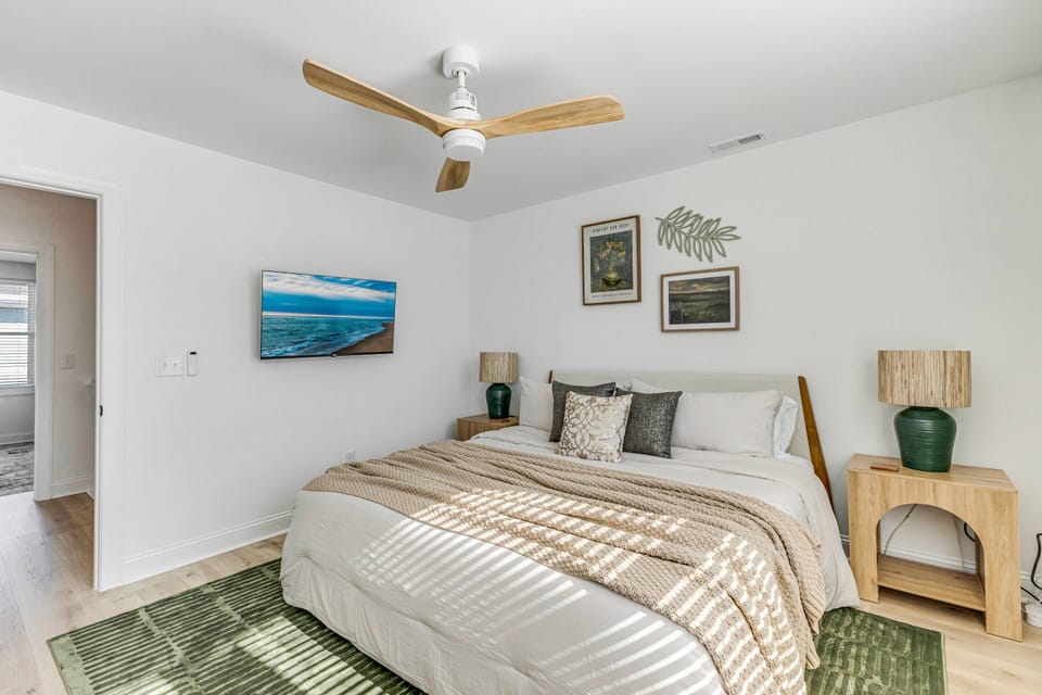 Additional King Bed With Warm Decor and 43 inch TV