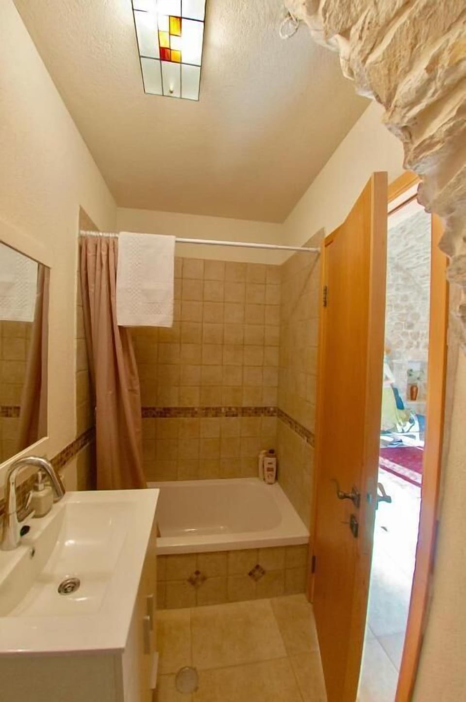 Suite, Kitchenette, Garden View | Bathroom | Hair dryer, towels, soap, shampoo