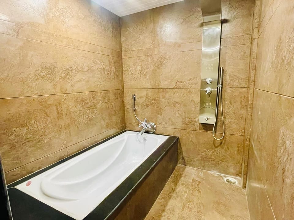 Family Suite, City View | Bathroom | Slippers, towels