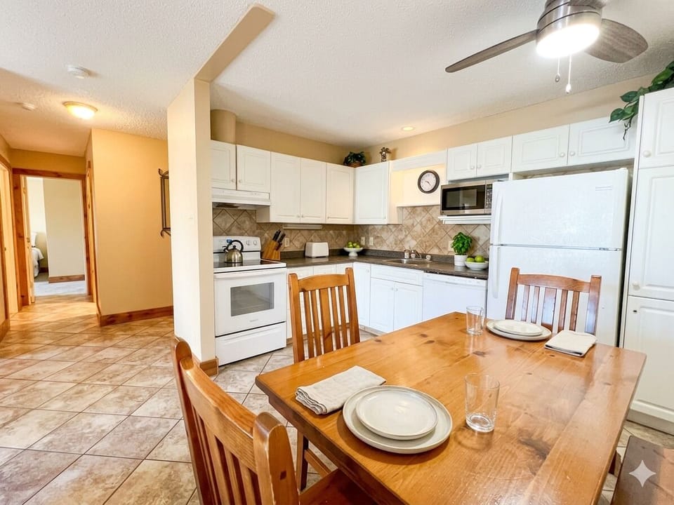 Fully stocked kitchen and dining area.