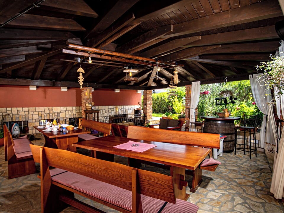 Furniture, Wood, Table, Chair, Restaurant, Ceiling, Kitchen & Dining Room Table, Wood Stain, Shade, Resort