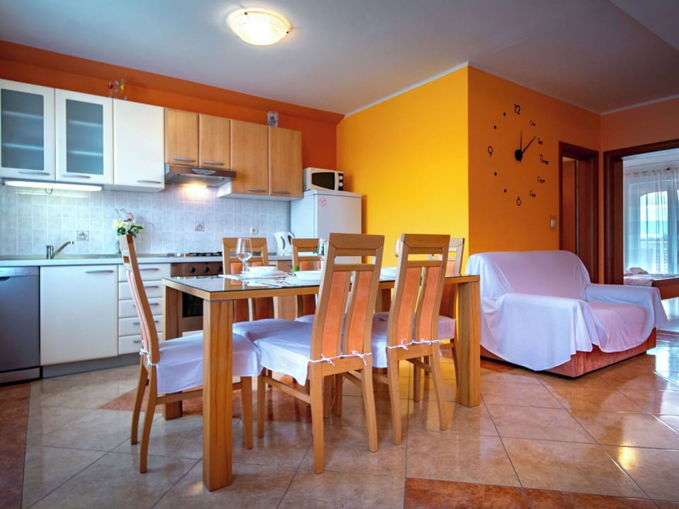 Furniture, Interior Design, Flooring, Floor, Wood, Ceiling, Room, Lighting, Table, Orange