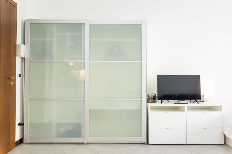Classic Studio, Balcony, Pool View | Living area | Flat-screen TV