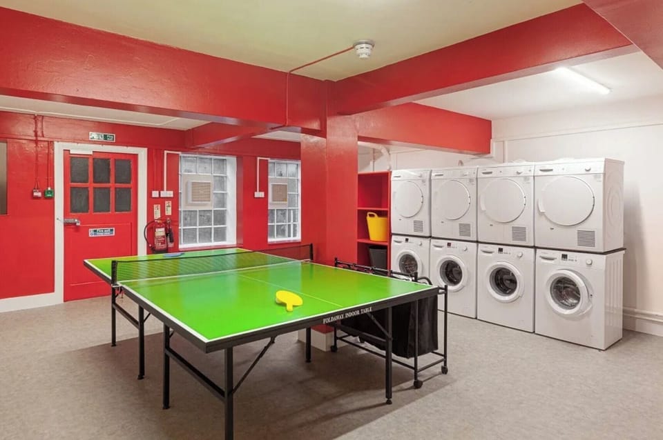 ping pong table and laundry area