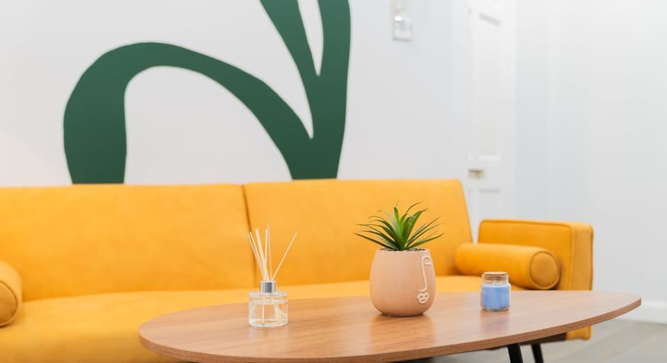 Contemporary living area details featuring a stylish coffee table, modern décor and comfortable sofa seating.