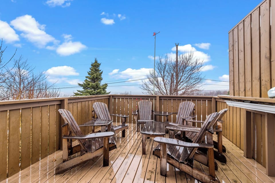 Step outside to unwind on the deck, furnished with classic wooden chairs—perfect for morning sun or evening breeze.