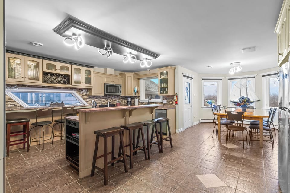 This inviting kitchen nook offers great lighting, a clean layout, and everything you need for home-style cooking.
