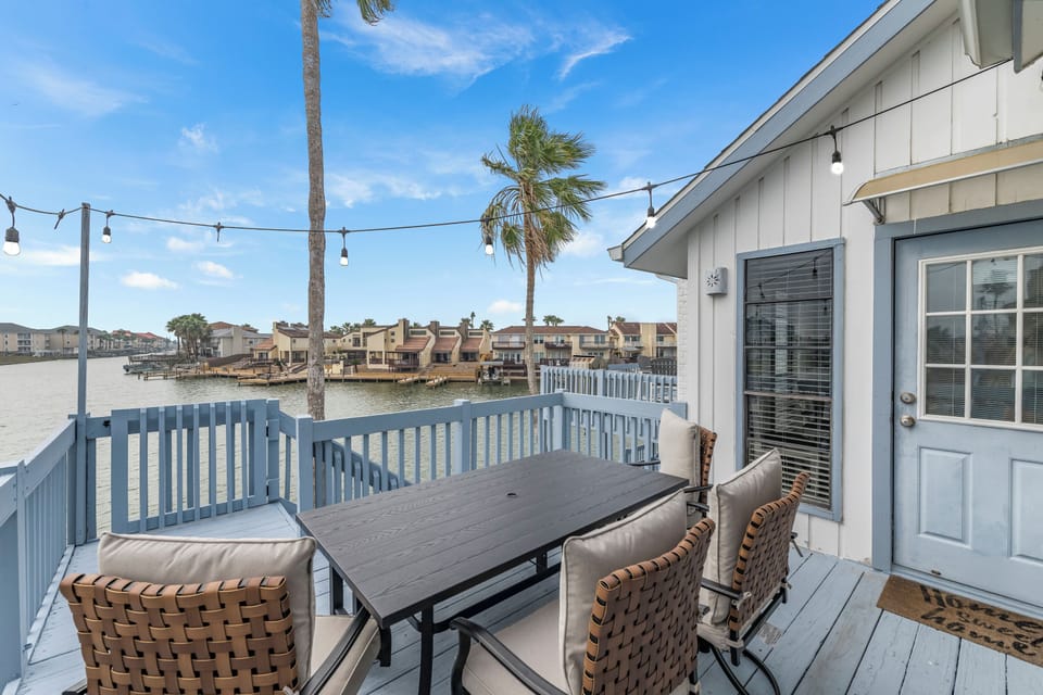 Sip your morning coffee on this waterfront deck while watching boats drift by the canal.