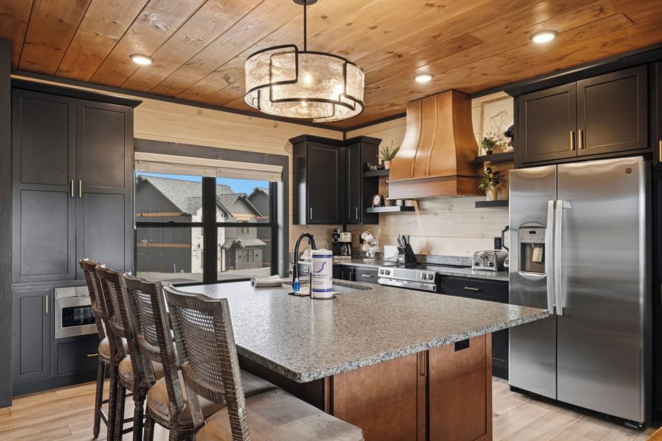 Fully equipped gourmet kitchen with stainless appliances
