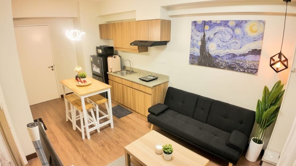 Comfort Condo, 1 Bedroom, Balcony, City View | Living room | 32-inch Smart TV with satellite channels, table tennis