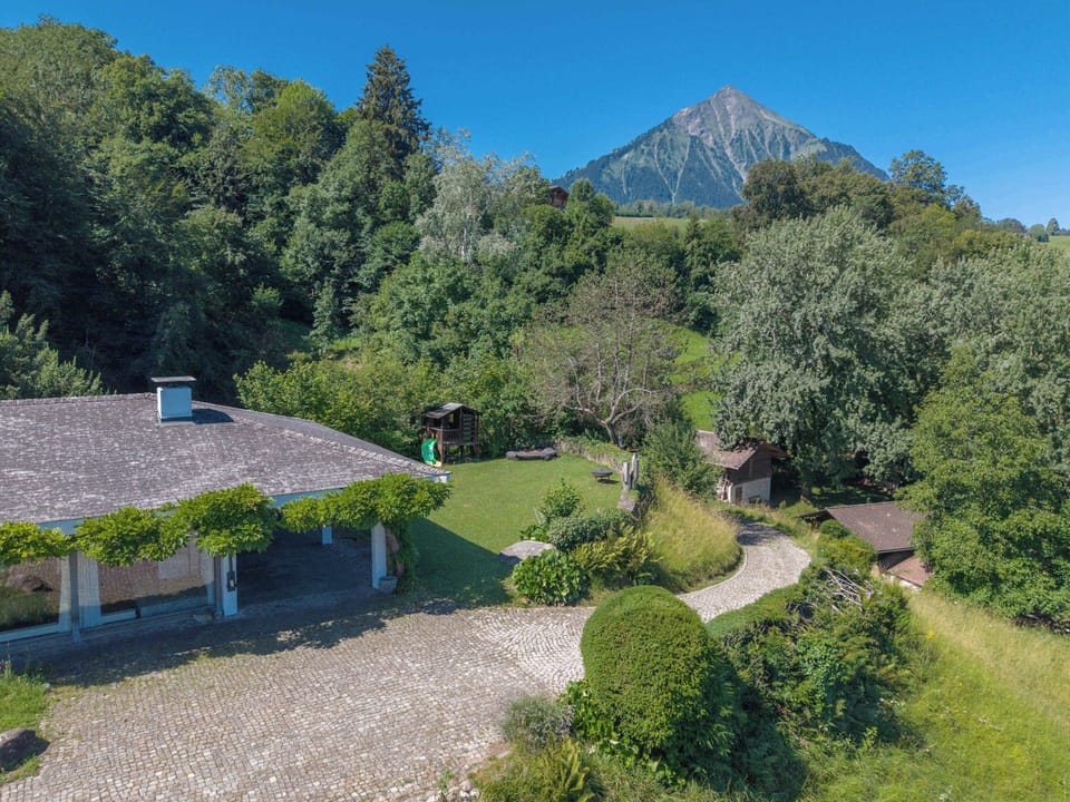 Exterior view of the villa with private garden and peaceful surroundings.
