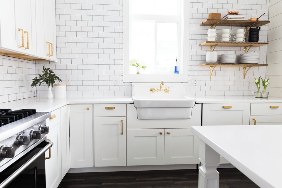 Stylish white kitchen with huge farmhouse sink