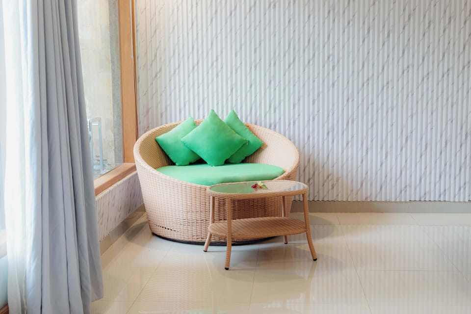 Junior Room, Pool View | Living area | 40-inch flat-screen TV with cable channels, TV